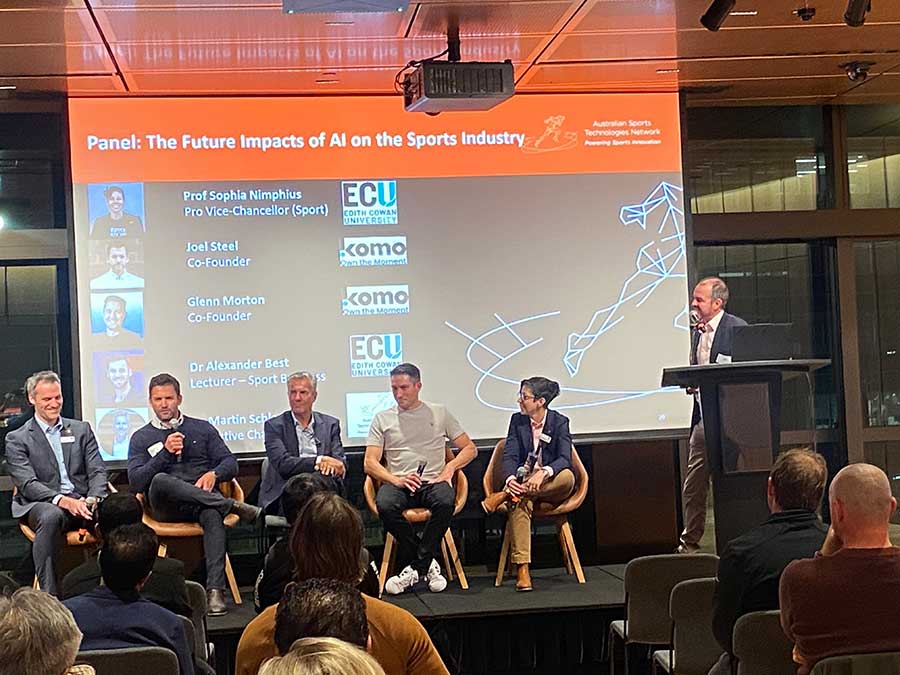 Craig Hill moderating panel discussion